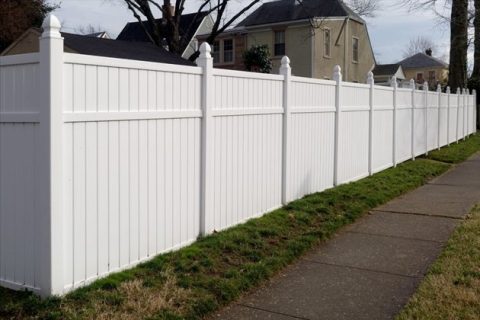 Decorative Vinyl fence around a garden, adding charm and protection